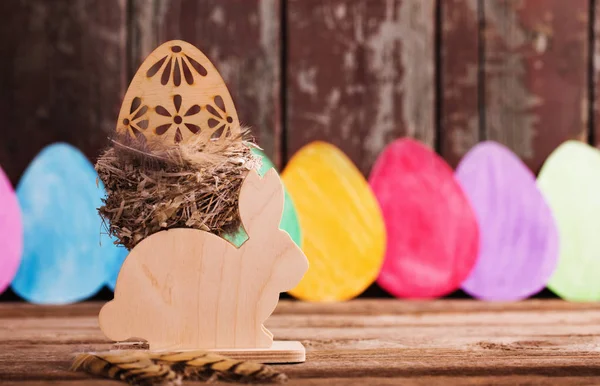 Easter paper eggs on wooden background — Stock Photo, Image