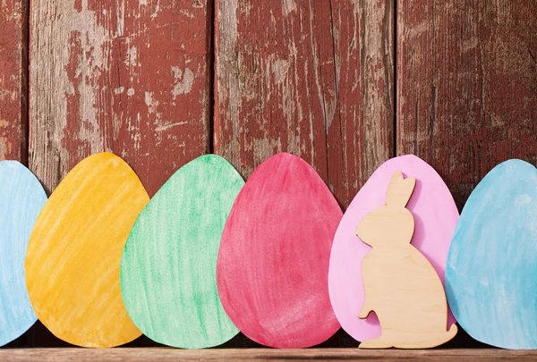 Easter paper eggs on wooden background — Stock Photo, Image