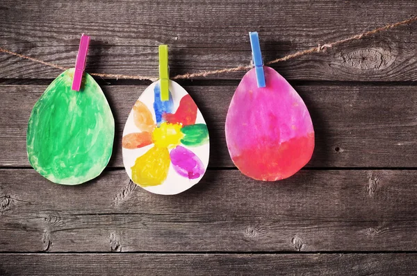 Child's drawing of Easter eggs on wooden background — Stock Photo, Image