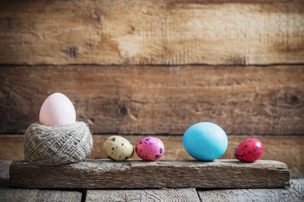 Easter eggs on old wooden background — Stock Photo, Image