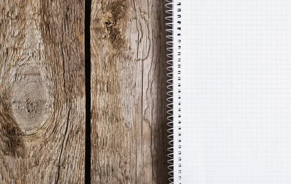 Notepad on old wooden background — Stock Photo, Image