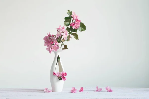 Pink apple spring flowers in vase on white background — Stock Photo, Image