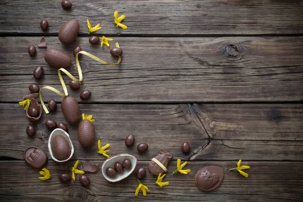 Chocolate eggs on dark wooden background — Stock Photo, Image