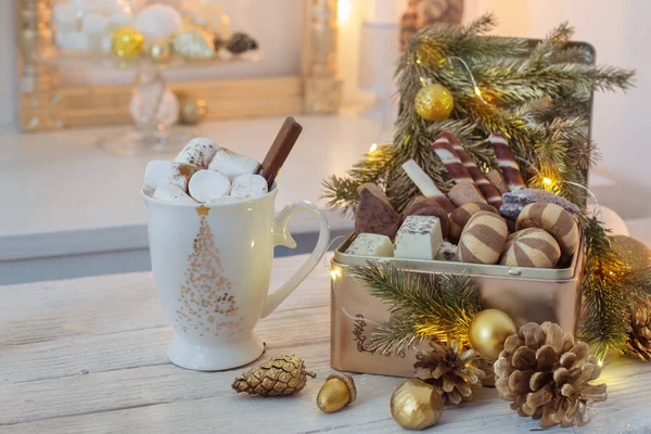 Christmas sweets in golden box and cocoa mug with marshmallows — Stock Photo, Image