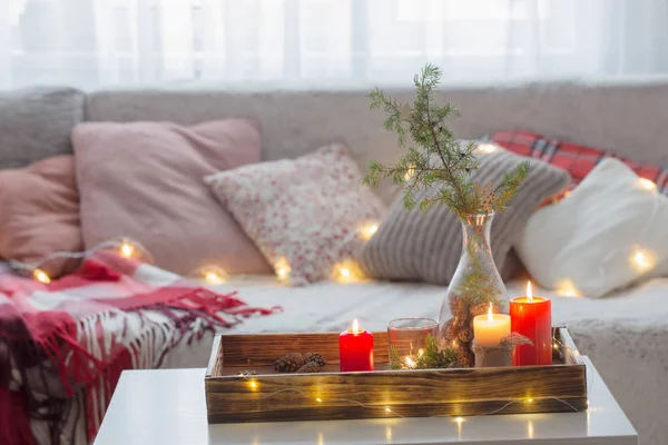 Composition of candles with juniper in vase on  white table agai — ストック写真