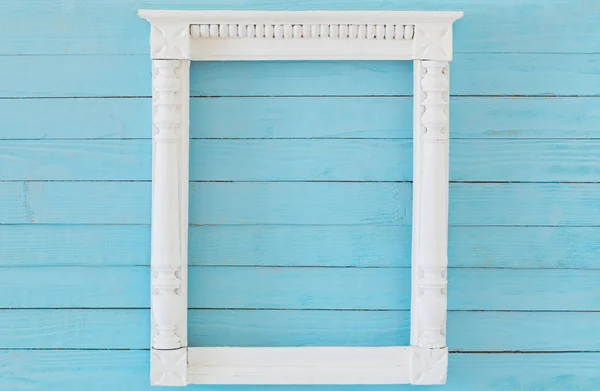 Wooden frame on background old blue wall — Stock Photo, Image