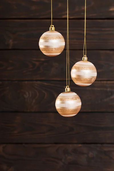 Christmas balls hanging  on  dark  wooden background — Stock Photo, Image