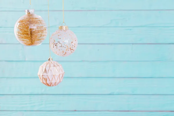 Christmas balls hanging  on  blue wooden background