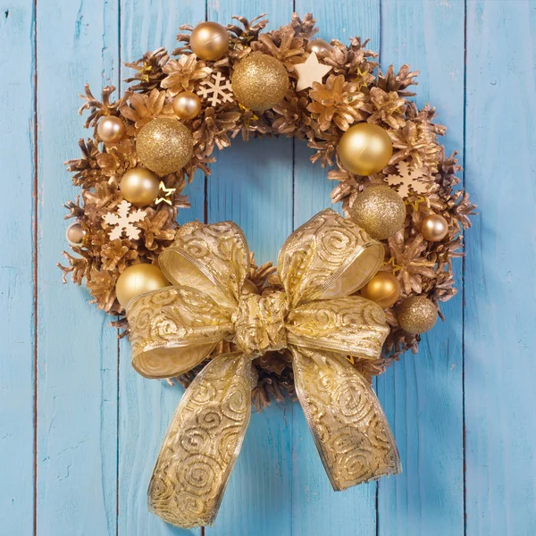 Christmas wreath on old blue  wooden background — Stock Photo, Image