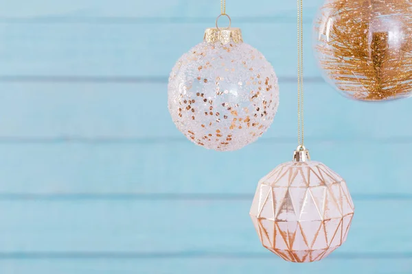 Christmas balls hanging  on  blue wooden background