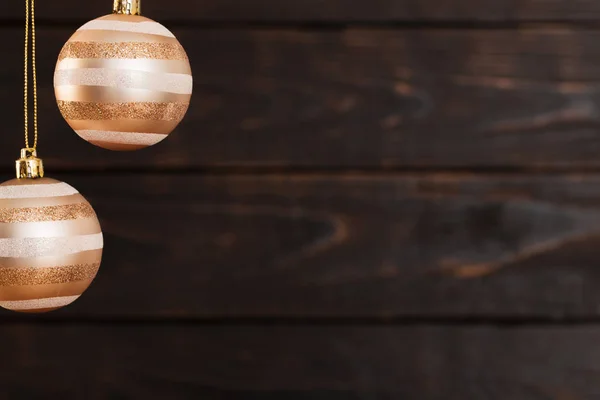 Christmas balls hanging  on  dark  wooden background — Stock Photo, Image