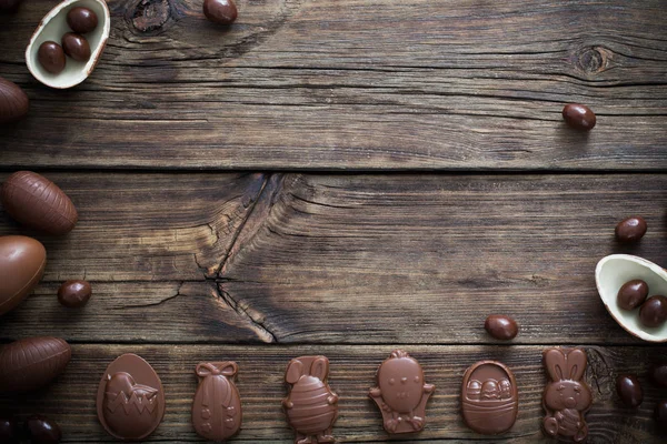 Chocolate eggs on dark wooden background — Stock Photo, Image