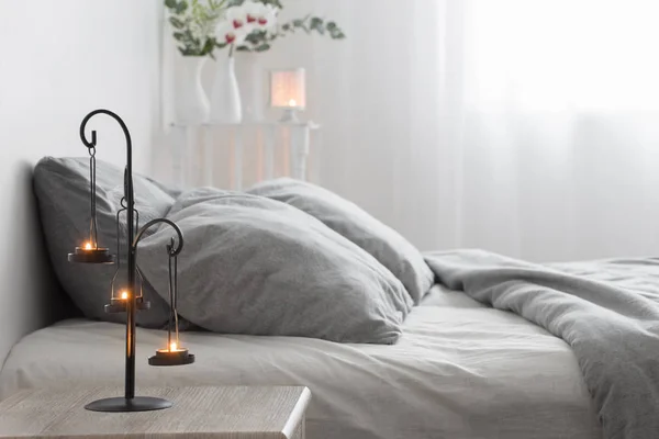 Antique candlestick with burning candles in bedroom — 스톡 사진