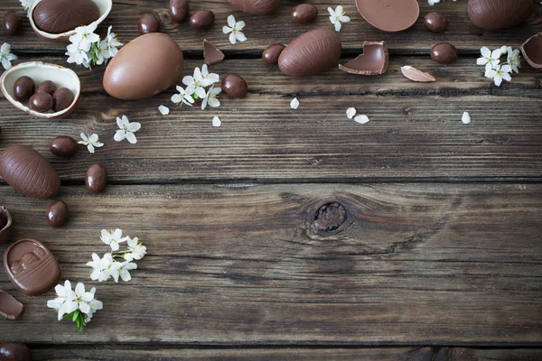 Chocolate eggs on dark wooden background — Stock Photo, Image