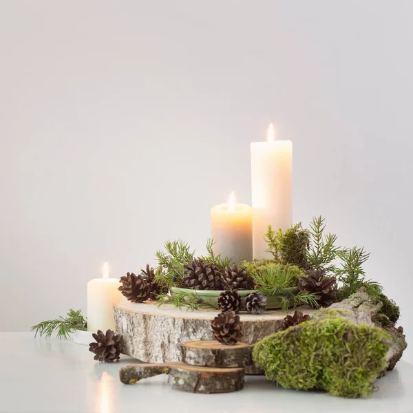 Burning Candles Saw Cones Branches White Background — Stock Photo, Image