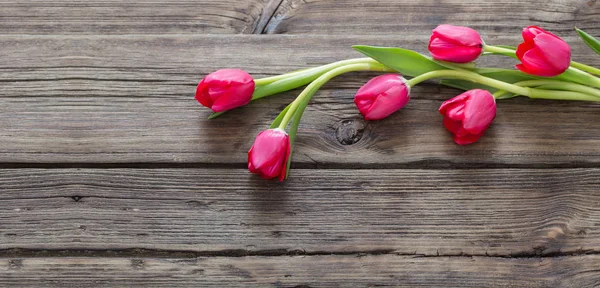 Red Tulips Dark Old Wooden Background — Stock Photo, Image