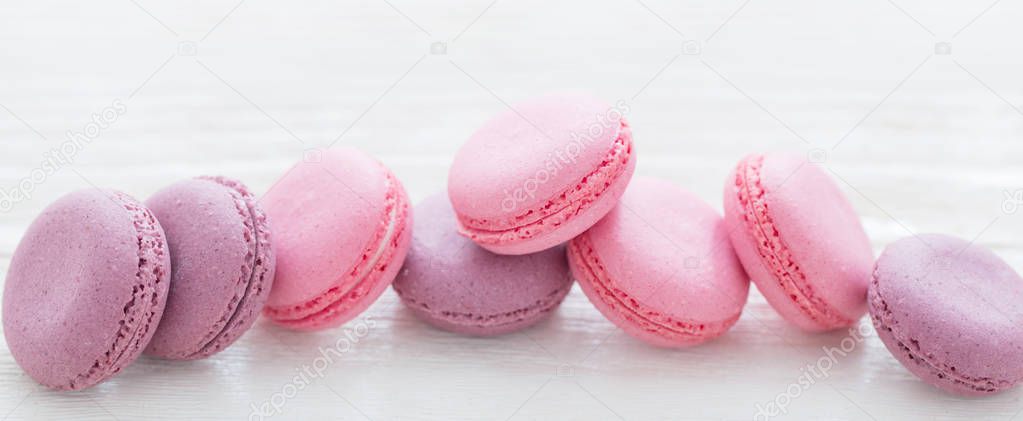 pink macaroons on wooden background