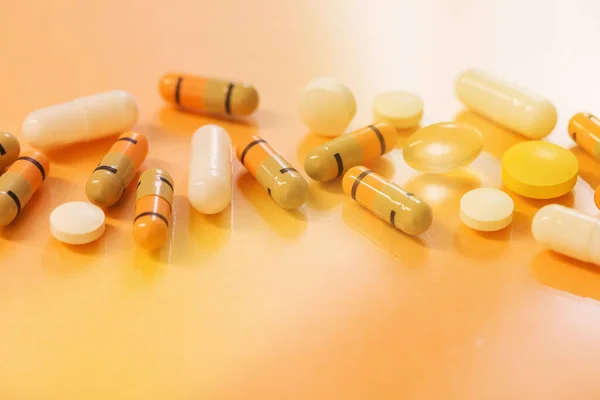 medicines  and pills on  orange  background