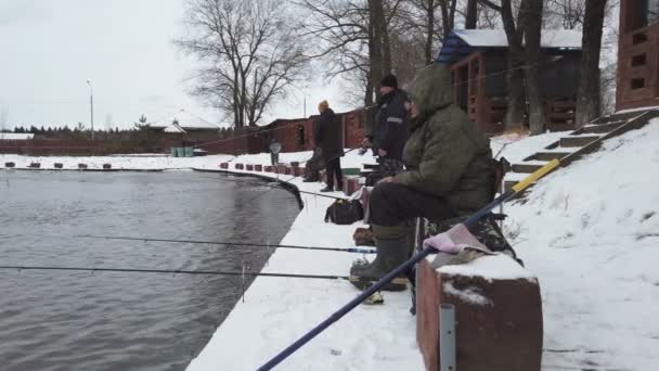 Anglers fishing in open water on a winter day — Stock Footage Anglers fishing in open water on a winter day Stock Footage