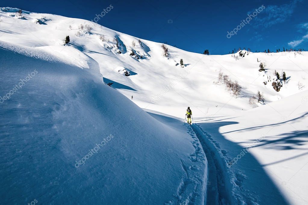 Splitboarder on the ski-tour trail