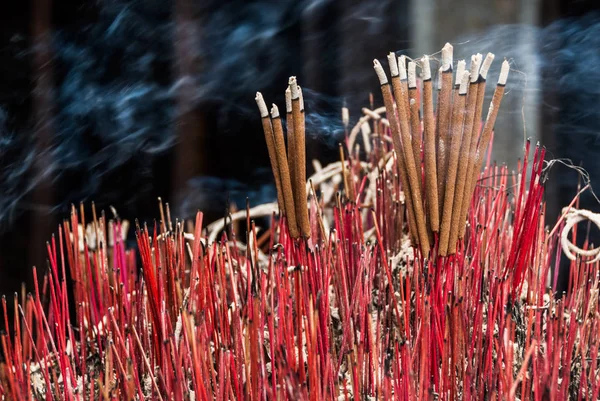 Smoking candles in asian temple — Stock Photo, Image