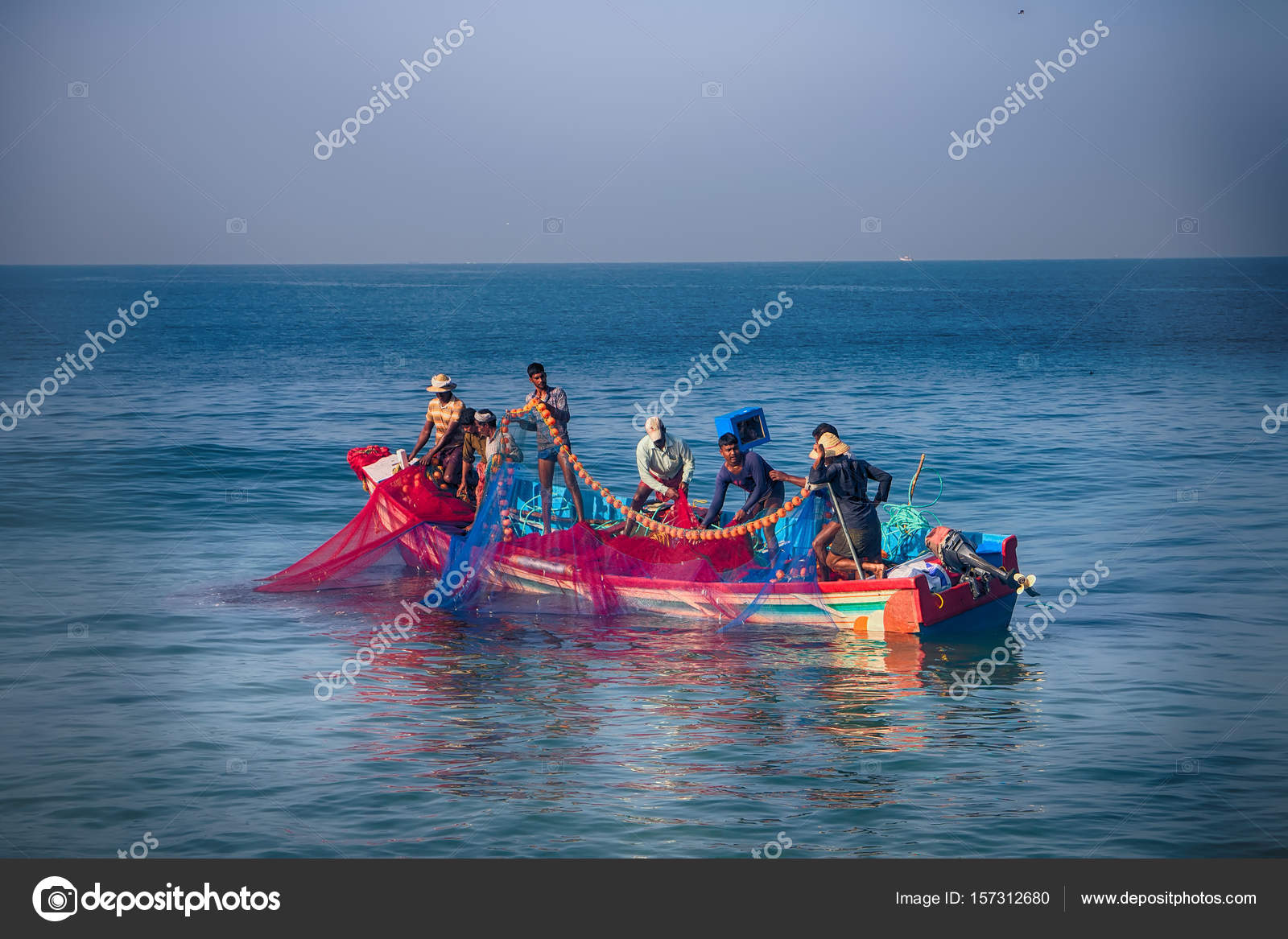 Indian Fishermen Graphically Pull Painted Seine Right In Boat 2