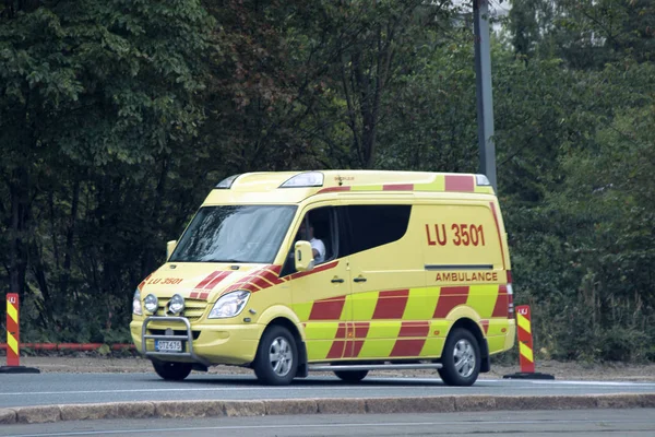 Ambulance bright coloring on the highway — Stock Photo, Image