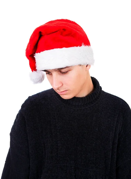 Giovane triste a Santa Hat — Foto Stock