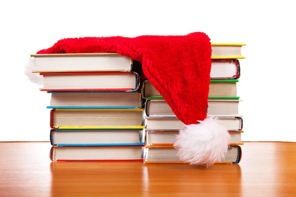 Weihnachtsmann auf den Büchern — Stockfoto