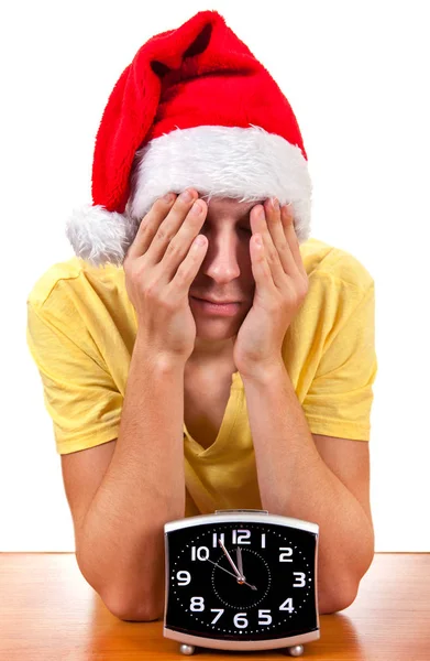 悲哀的年轻人在圣诞老人的帽子 — 图库照片