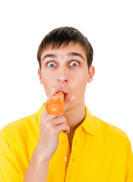 Jonge man met een wortel — Stockfoto
