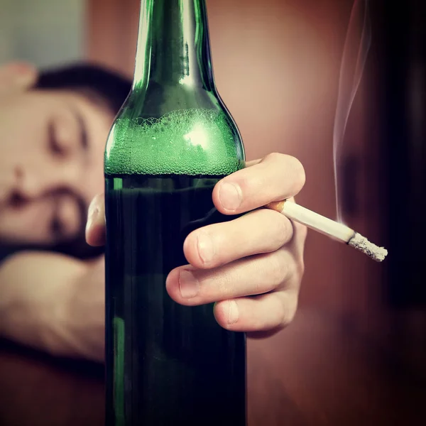 Young Man sleep with a Beer Royalty Free Stock Photos