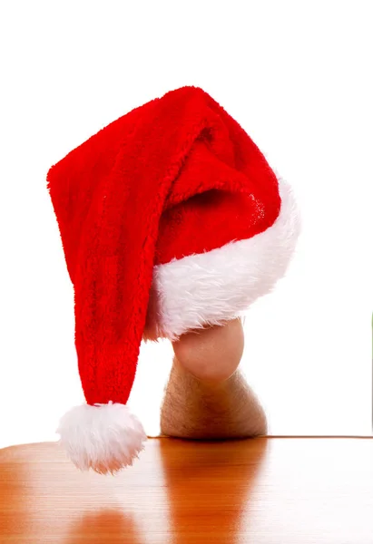 Sombrero de Santa en la pierna —  Fotos de Stock