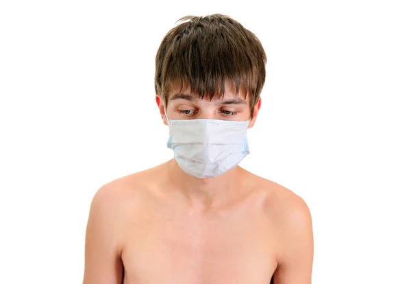 Trauriger Teenager mit Grippe-Maske — Stockfoto