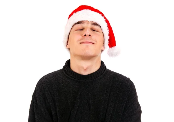 Jonge man in Kerstman hoed — Stockfoto