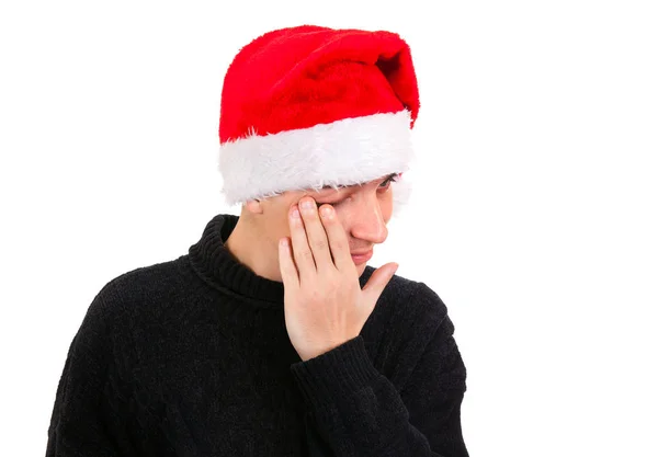 悲哀的年轻人在圣诞老人的帽子 — 图库照片