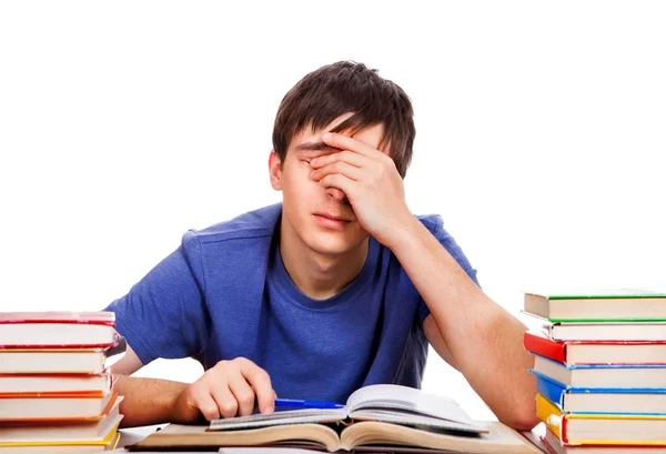 Втомлений студент з книжками — стокове фото