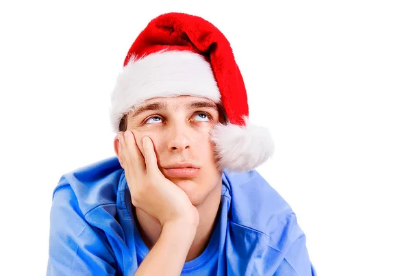 Unglücklicher junger Mann mit Weihnachtsmütze — Stockfoto