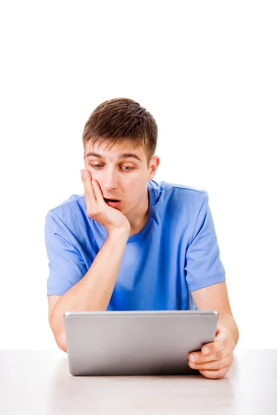 Surprised Young Man with a Tablet — Stock Photo, Image