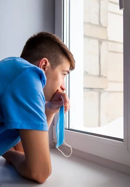 Pensive Young Man Window Hold Flu Mask — Stock fotografie