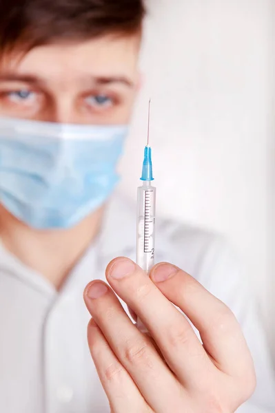 Young Man Syringe Wall Room — Stock Photo, Image