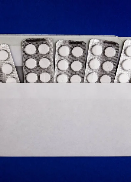 Prázdné Pilulky Papír Pozadí Modré Lepenky — Stock fotografie