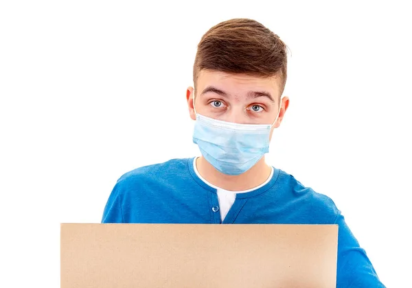 Junger Mann Mit Grippemaske Hält Ein Weißes Brett Isoliert Auf — Stockfoto