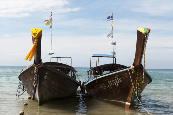 Two large traditional Thai boats with colorful ribbons and flags. Thailand Krabi — Stock Photo, Image