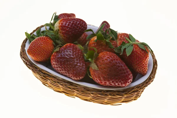 Strawberry background, basket with ripe strawberries close-up on white background. — Stock Photo, Image