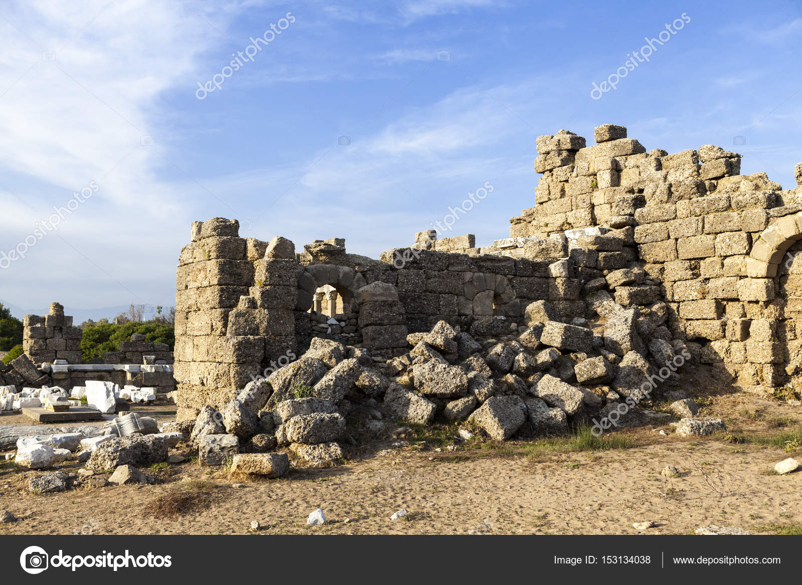 Beautiful background with ancient ruins and Sunny summer day. The old ruined  walls of the ancient city . ⬇ Stock Photo, Image by © mcherevan #153134038