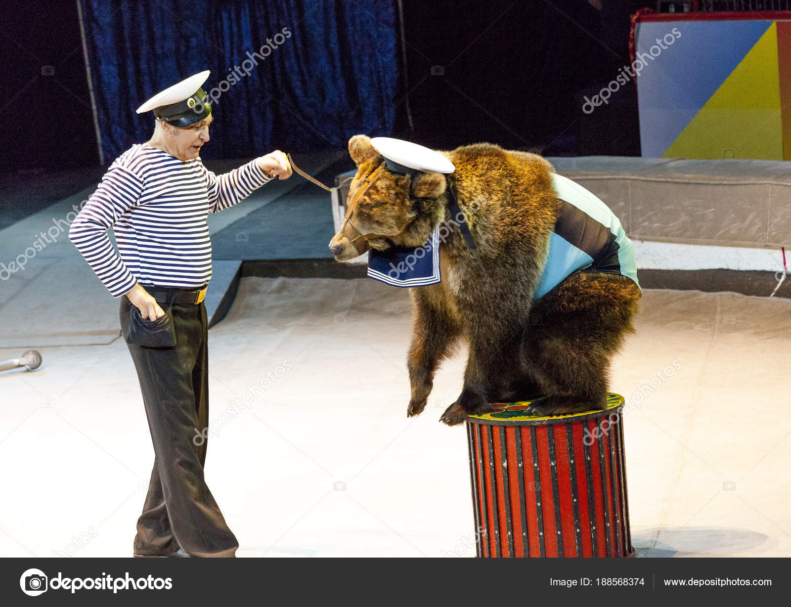 Circus. Bear And Trainer Performs In The Arena Of The Circus.