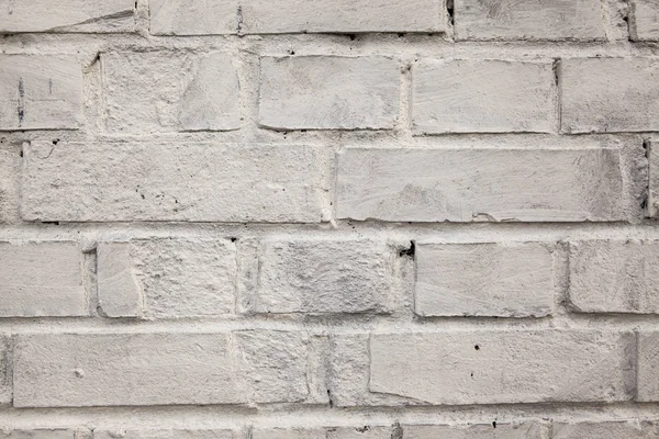 Muro de ladrillo, ladrillo viejo. El patrón de la estructura de una pared de ladrillo con mampostería. Viejo muro hogar europeo — Foto de Stock
