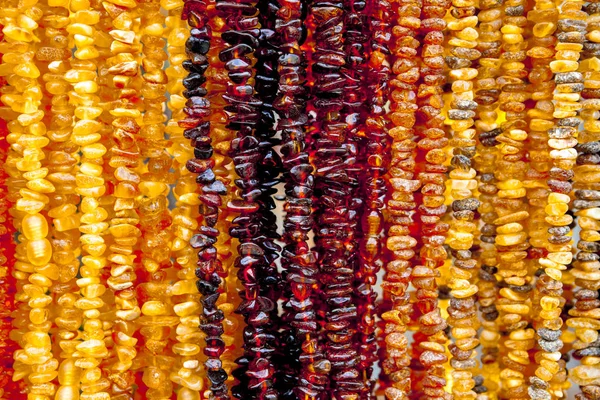 Amber necklace. Amber of different colors and sizes. — Stock Photo, Image