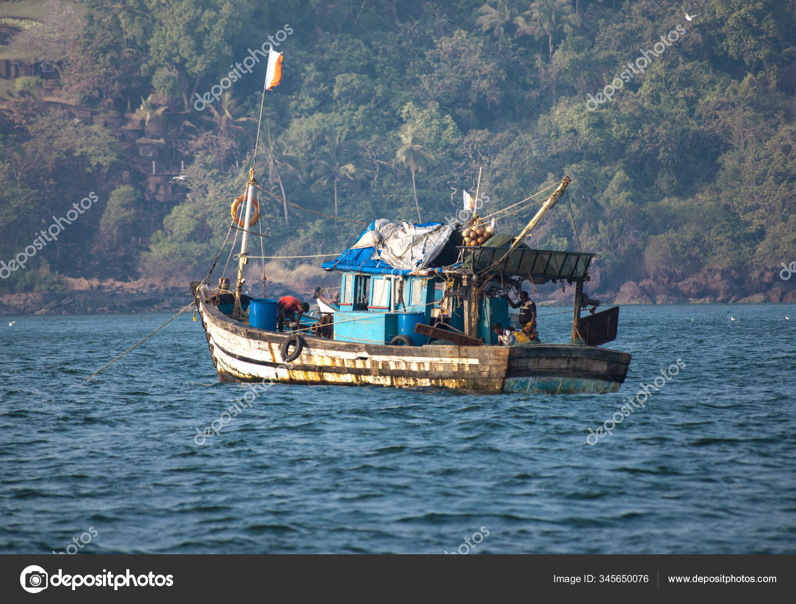 An old Indian fishing boat. The ship sails on the sea in search of fish. —  Stock Editorial Photo © mcherevan #345650076